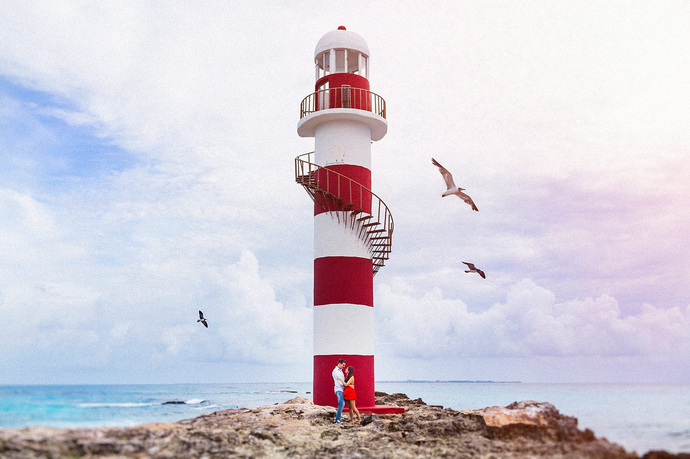 Cancun engagement photos with iconic lighthouse at Hyatt Ziva by Jhankarlo Photography